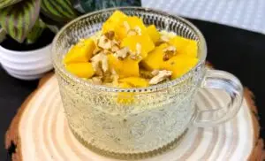 Creamy mango overnight oats in a jar topped with chia seeds